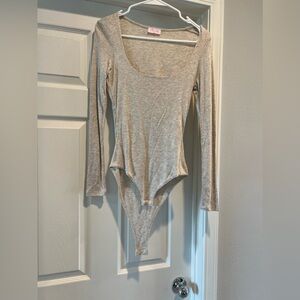 Pink lily bodysuit (would fit a Medium or Large better)